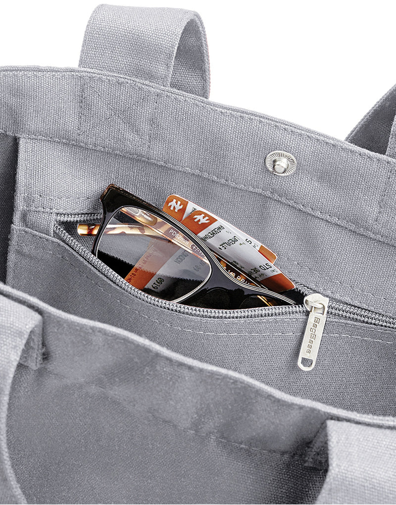 Close-up of the durable canvas material and dual carry handles on the Bagbase Canvas Day Bag.