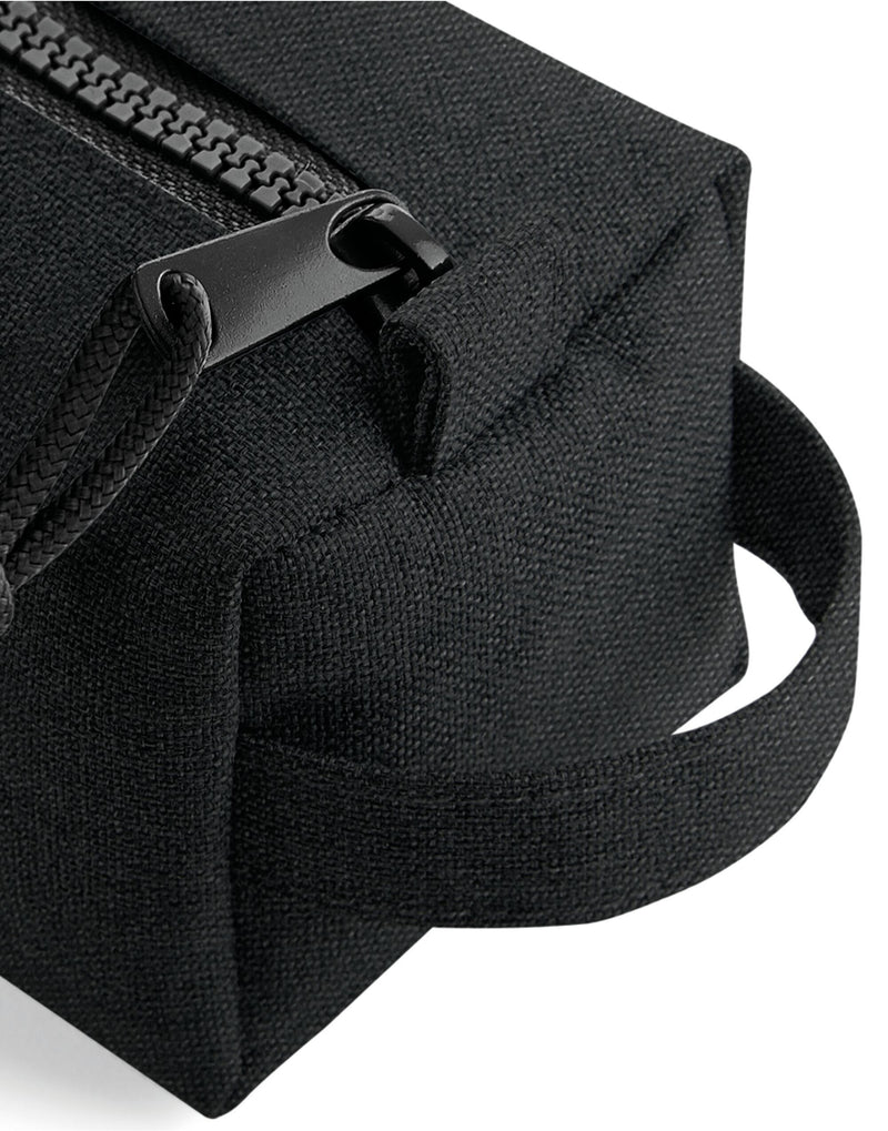 The black Bagbase Essential Pencil Case, shown open to reveal the interior for storing stationery.