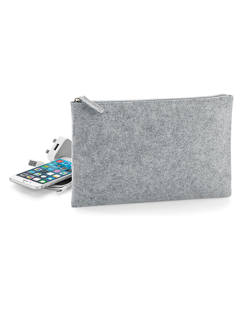 A person holding the dark grey Bagbase Felt Accessory Pouch to show its handy size.