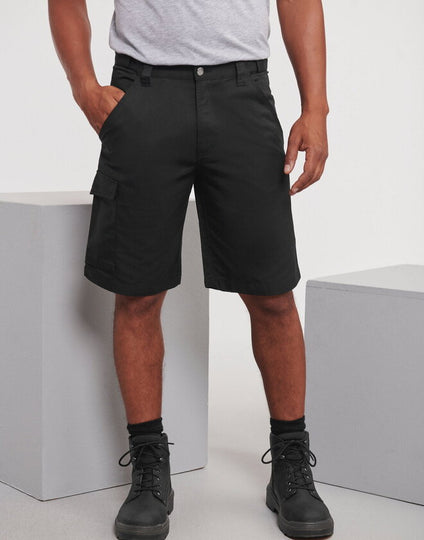a man wearing the Russell Polycotton Twill Shorts
