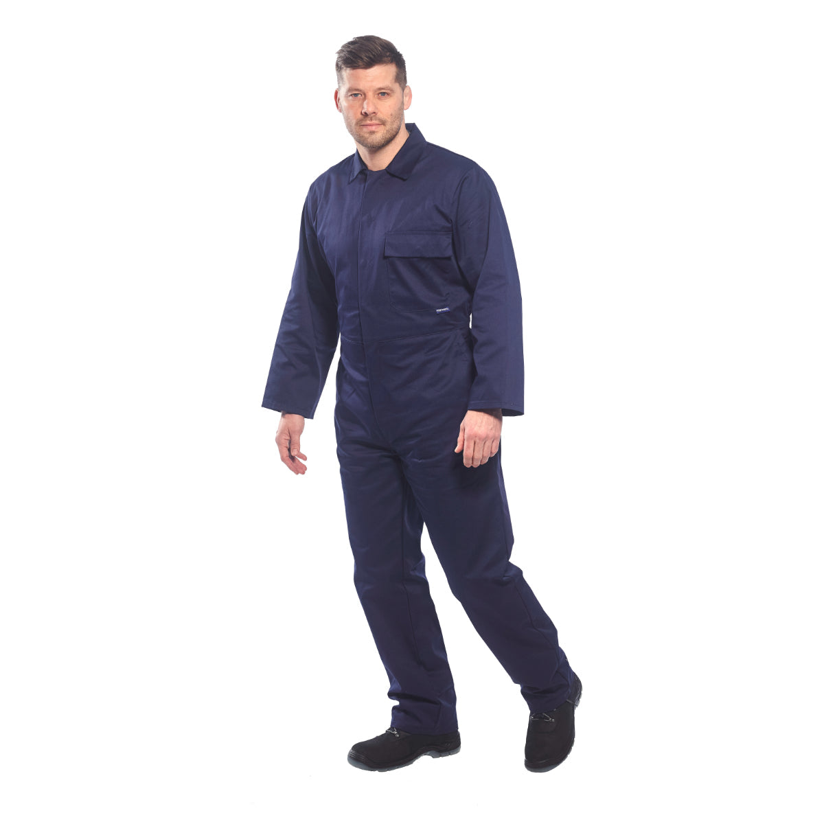 Portwest work shirt in navy worn by model in warehouse setting