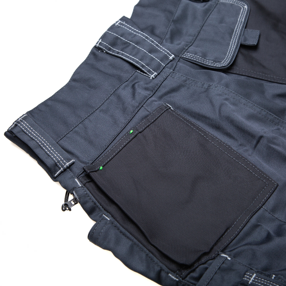 Close-up on the durable fabric and button of the ATS cargo shorts.