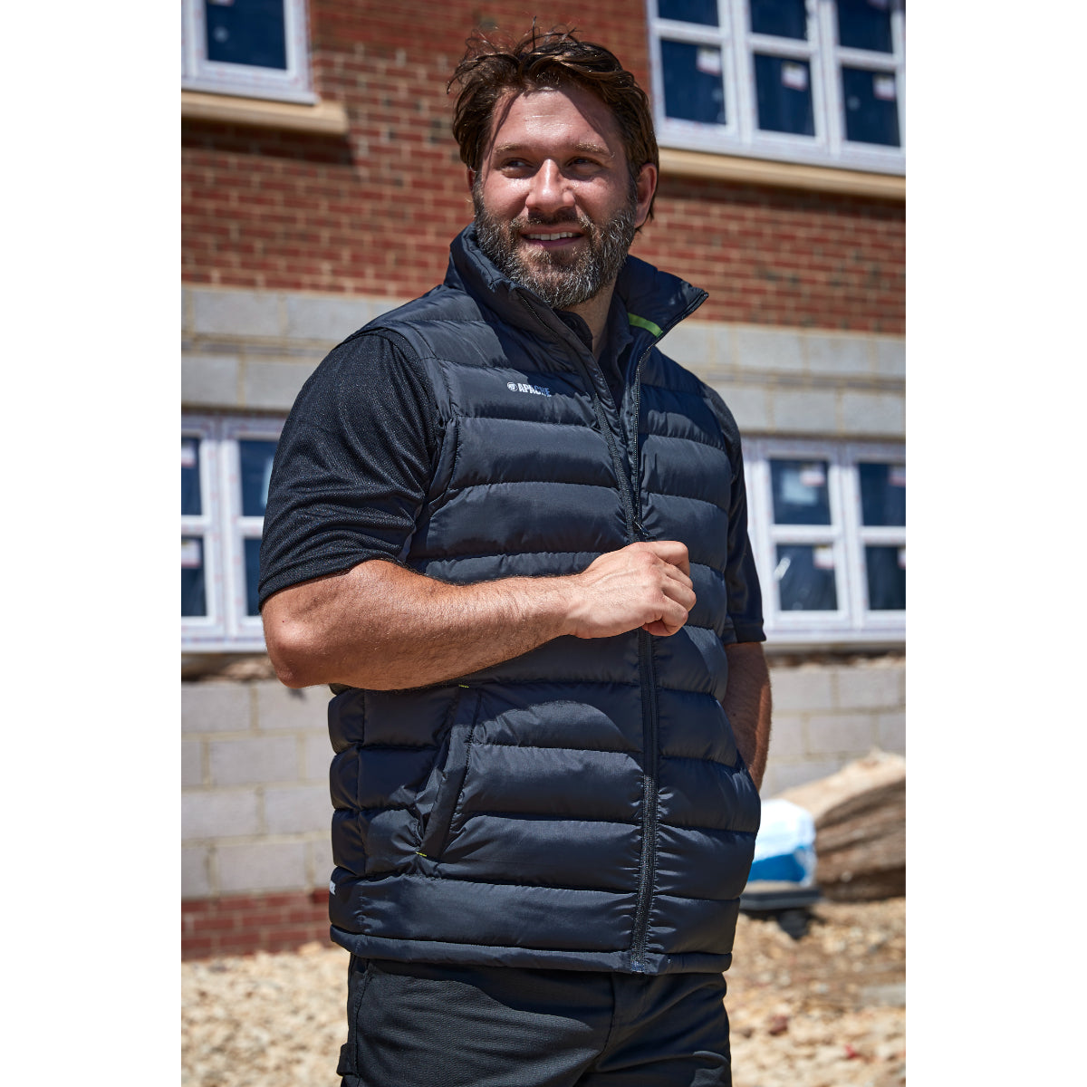 Detail shot of the chest logo and zip on the Apache ATS gilet.