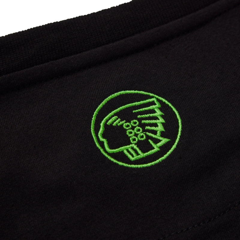 Detailed shot of the short sleeve and hem of the black Apache Delta t-shirt, highlighting the quality of the fabric.