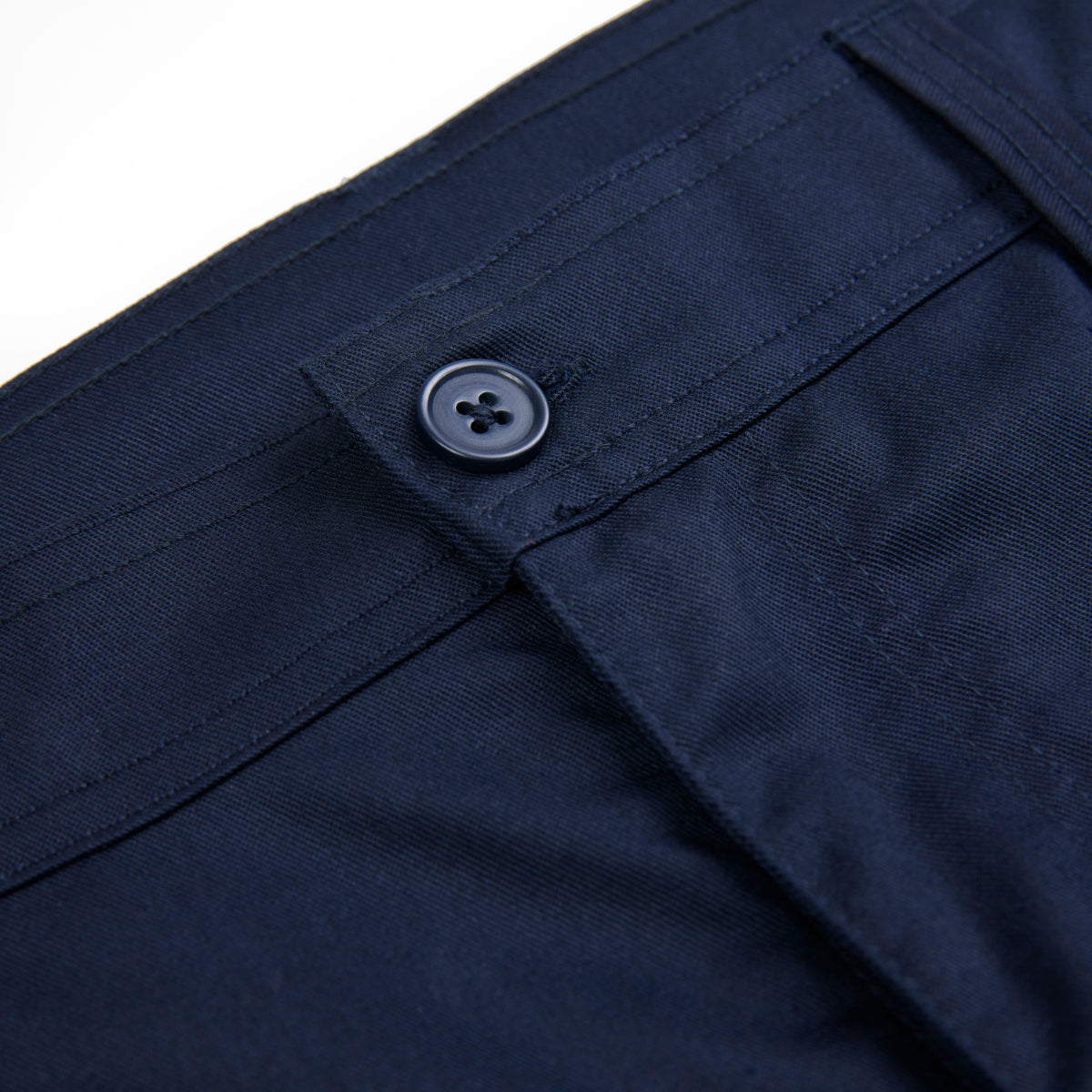 Close-up on the material and belt loops of the navy Apache Banff shorts.