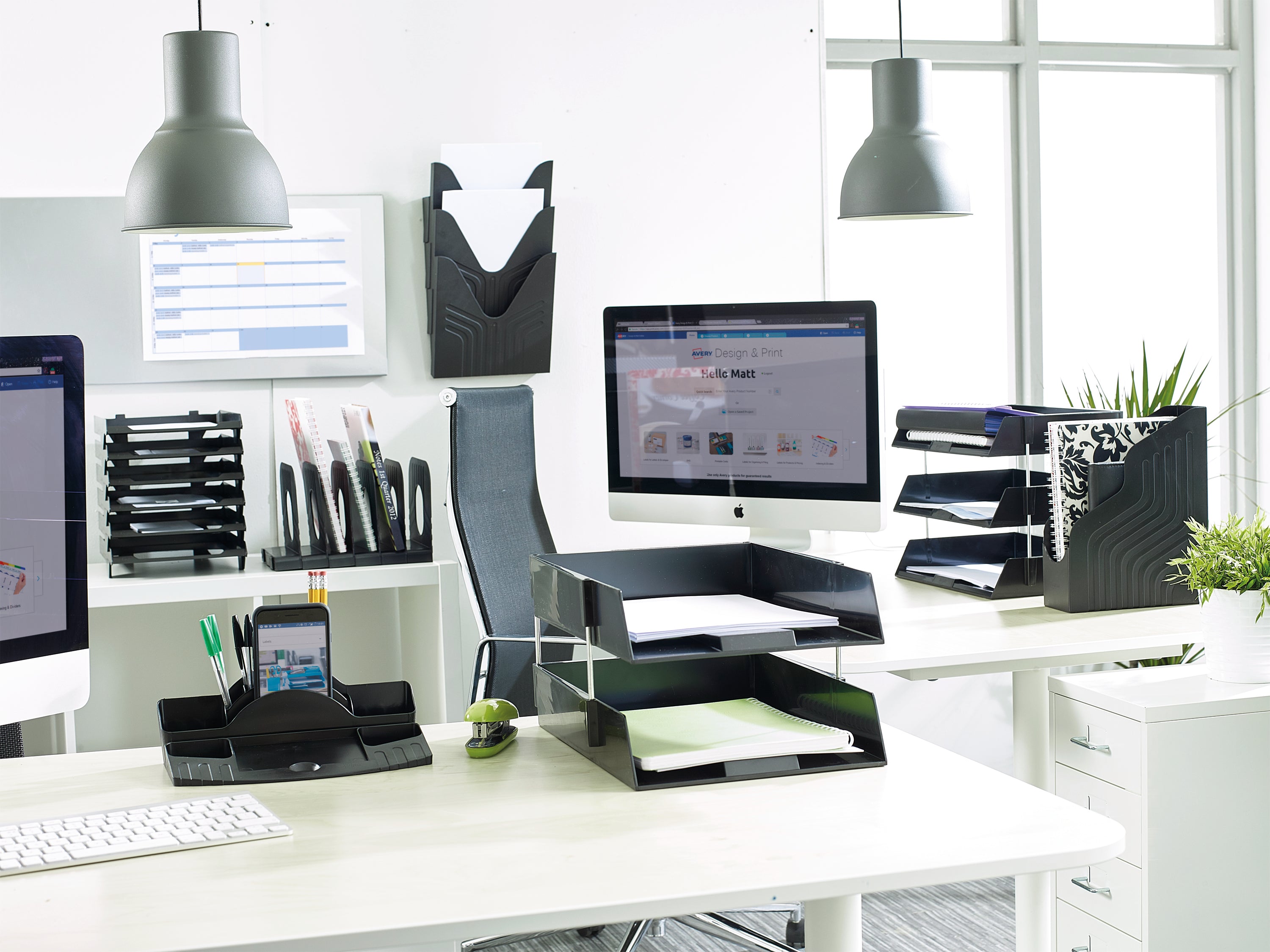 A single tiered black plastic literature holder for desks.