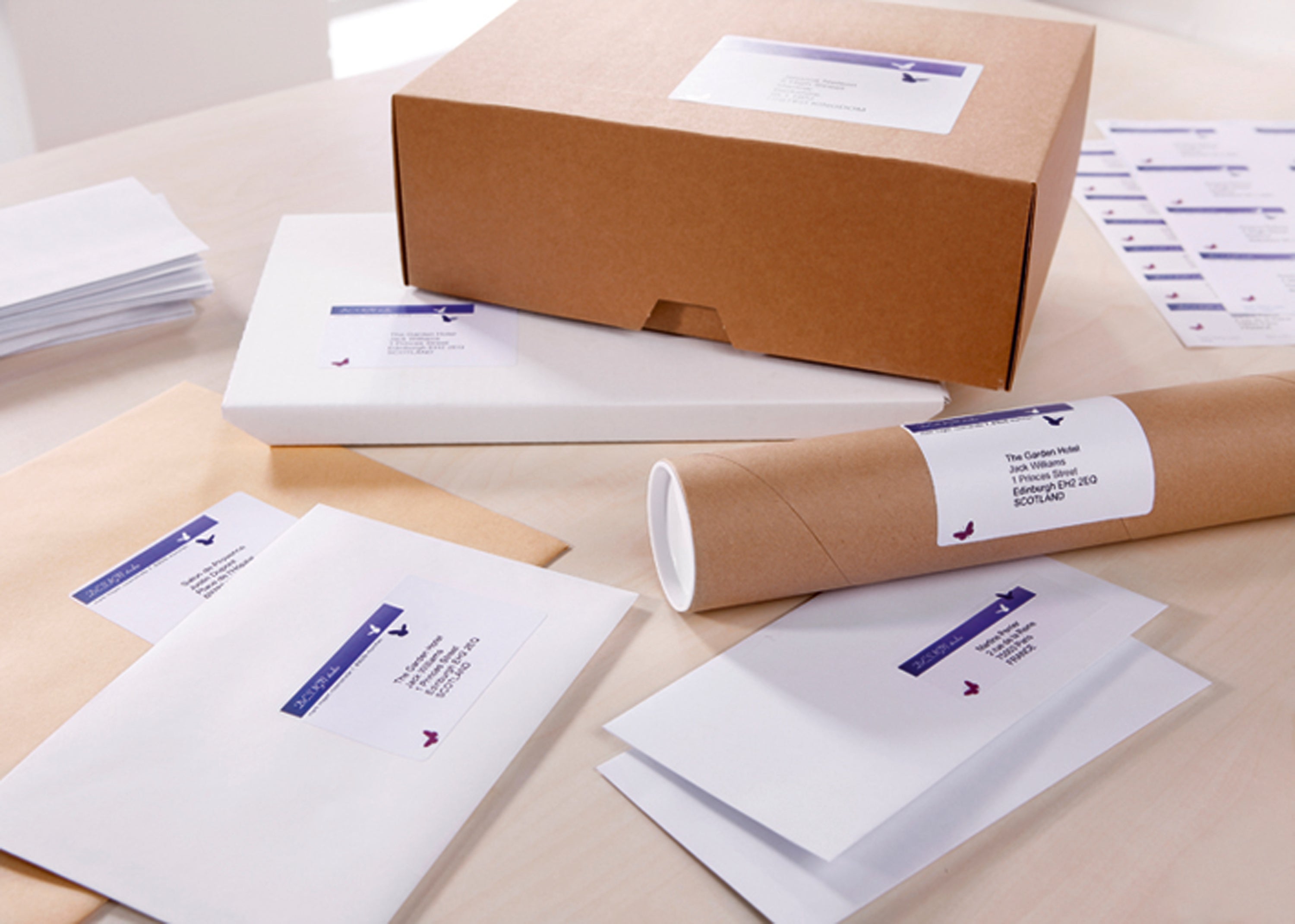 A large shipping box with a clear, smudge-free Avery J8168 label.