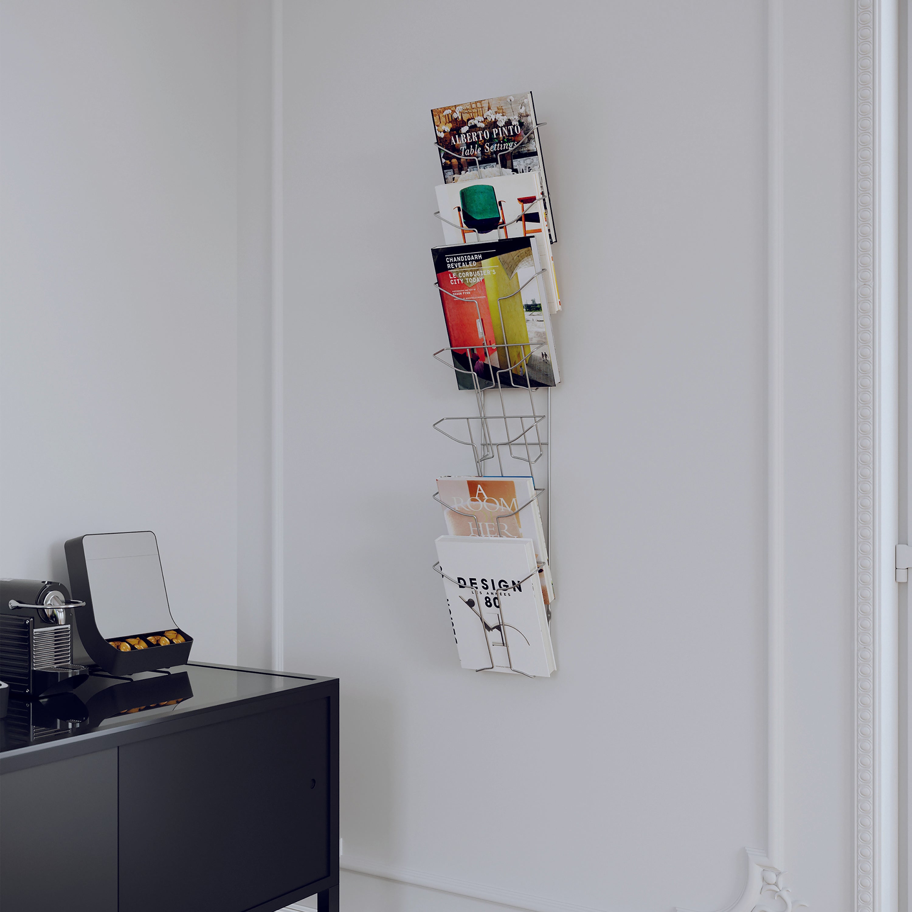 Side profile of Alba chrome A4 7-pocket wall-mounted literature display holder