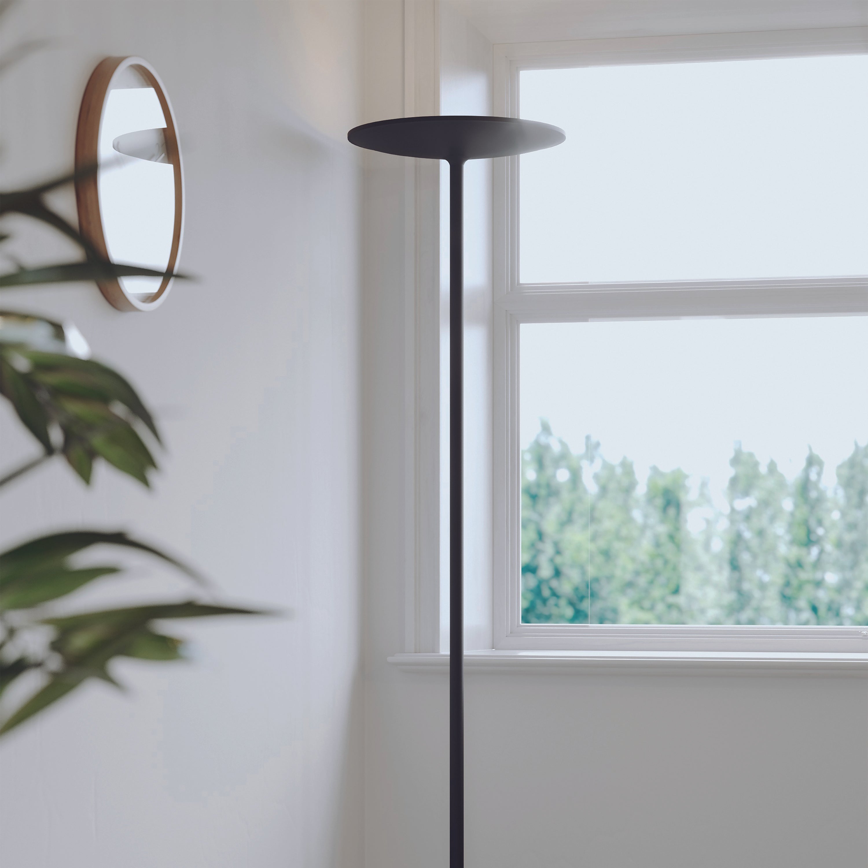 Alba Slim black LED floor lamp featuring round head and stable base design