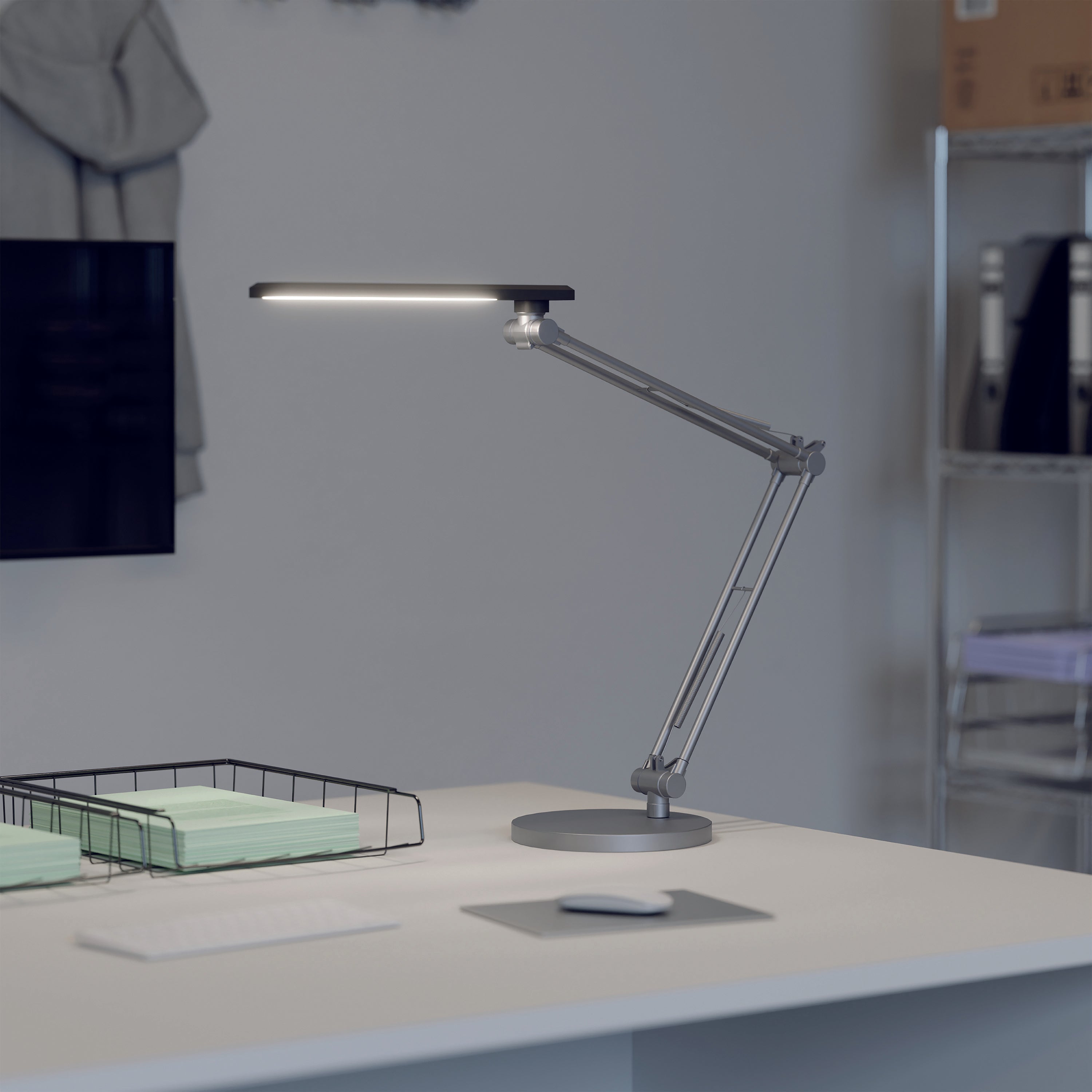 Alba black Trek LED desk lamp with tall vertical frame and round base