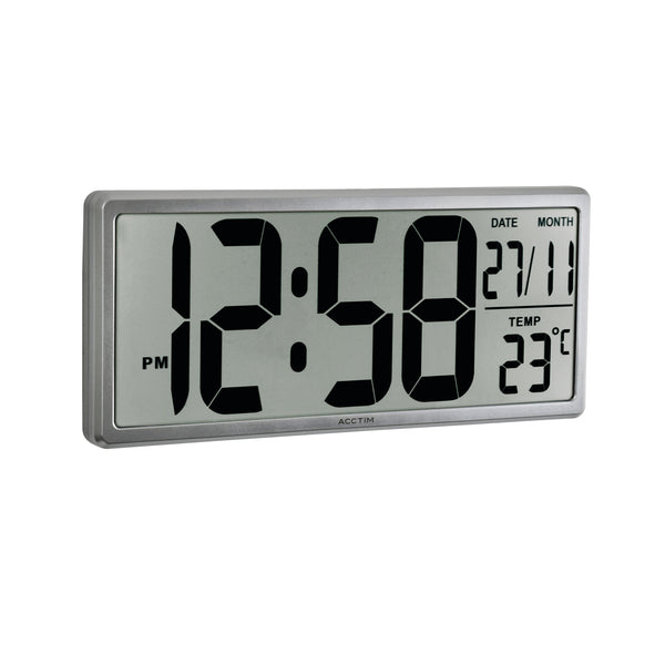Lifestyle view of the Acctim Date Keeper clock on a desk, showcasing its large, easy-to-read digital display and auto-set feature.
