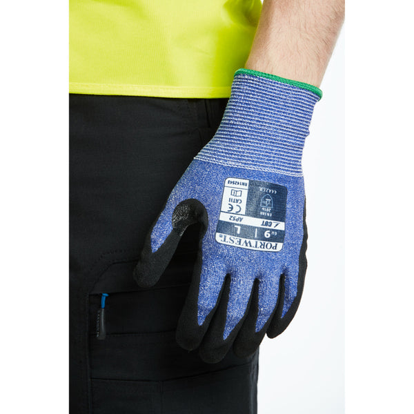 A person wearing the blue and black Portwest Dexti-Cut Ultra glove.