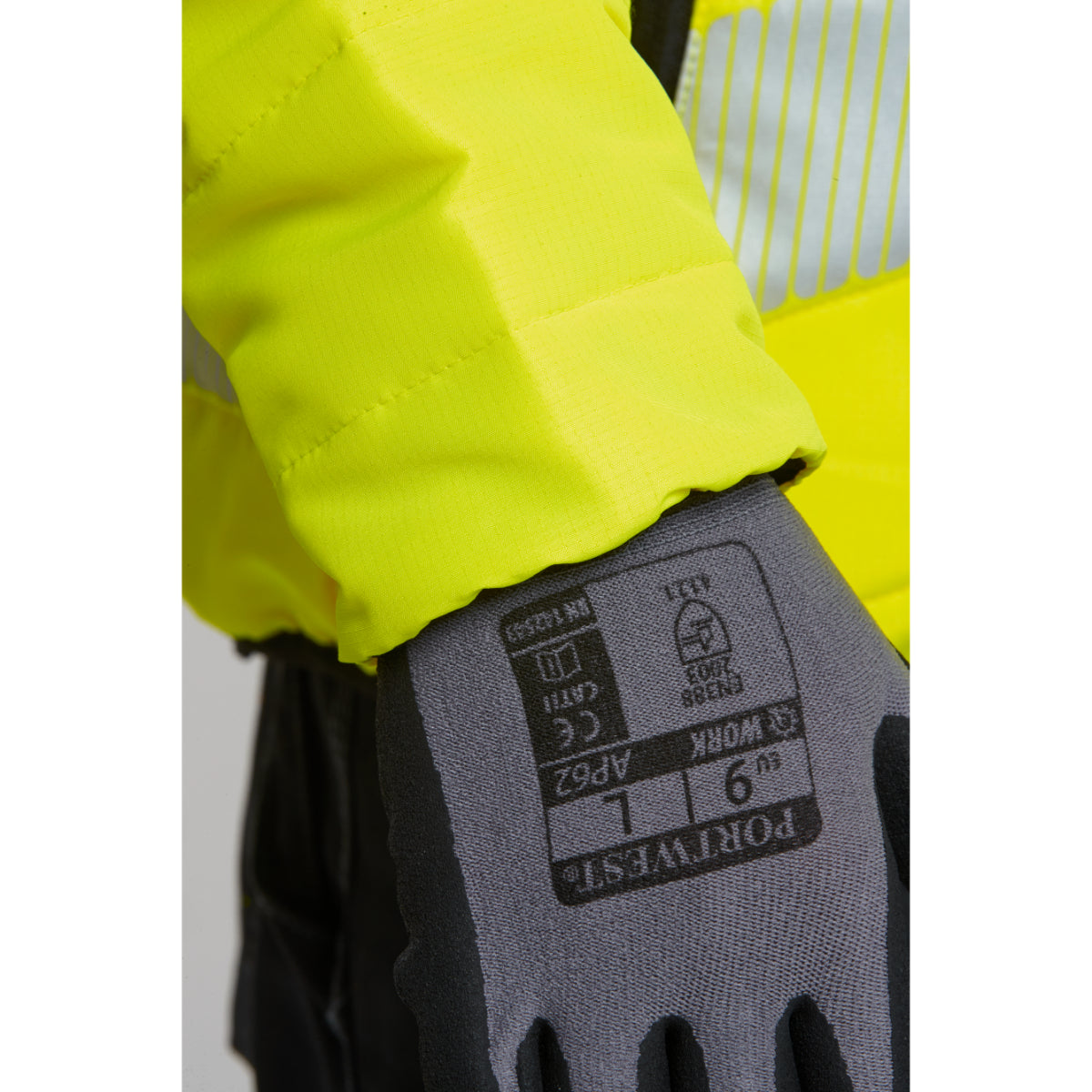 A person wearing the grey and black Portwest Dermiflex Aqua glove.