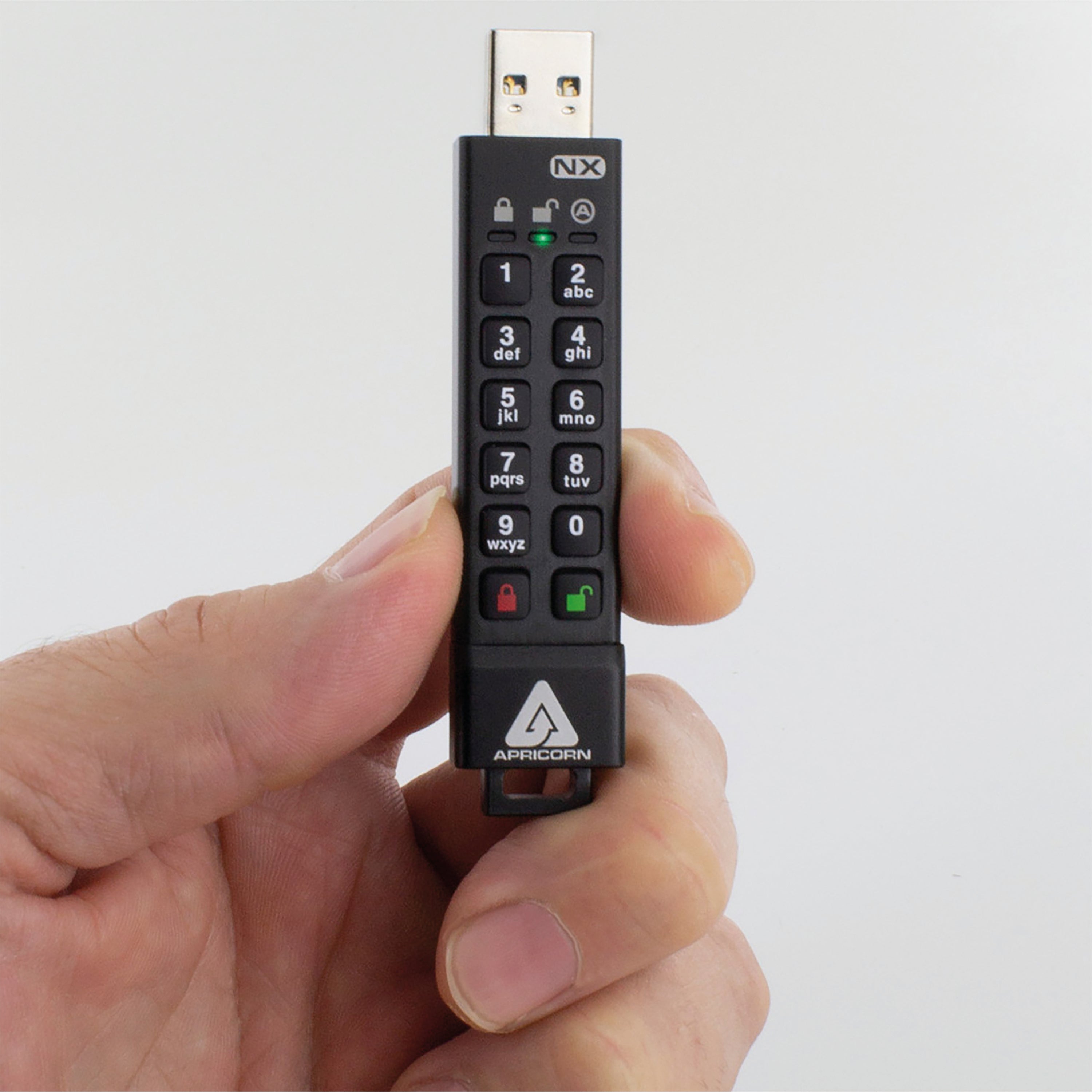 The Apricorn Aegis Secure Key 3NX 64GB flash drive shown inside its protective case.