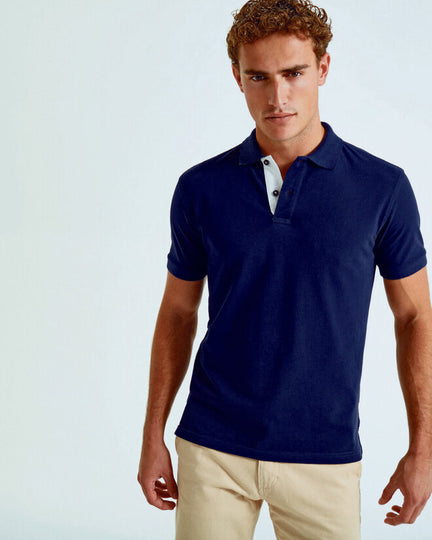 A full range of Asquith and Fox men's classic fit contrast polo shirts AQ012, neatly folded.