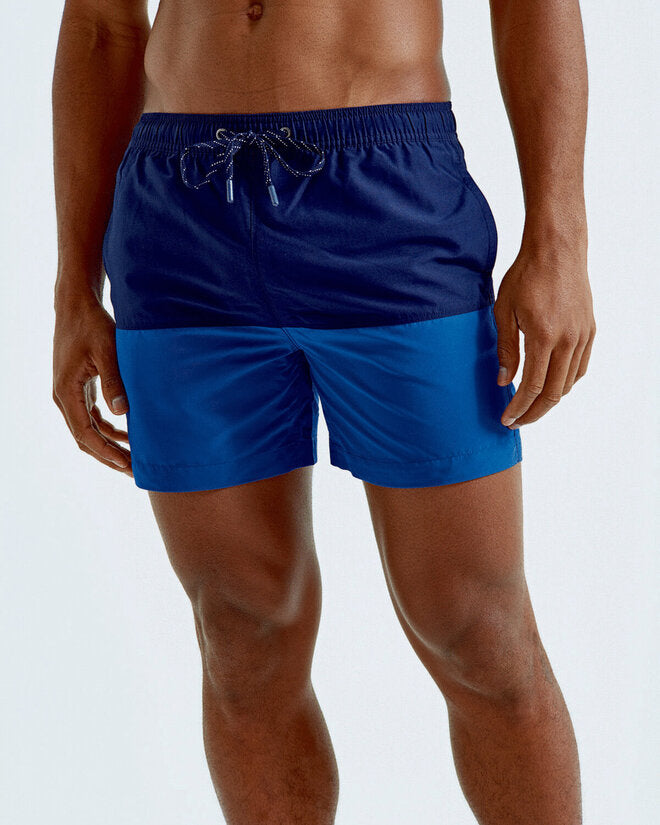 A lifestyle shot of the Asquith and Fox block colour swim shorts AQ056, showing them in action.