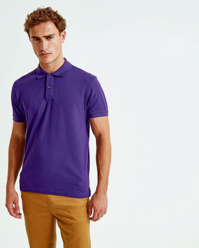 A collection of colorful Asquith and Fox men's organic polo shirts AQ082, folded neatly.