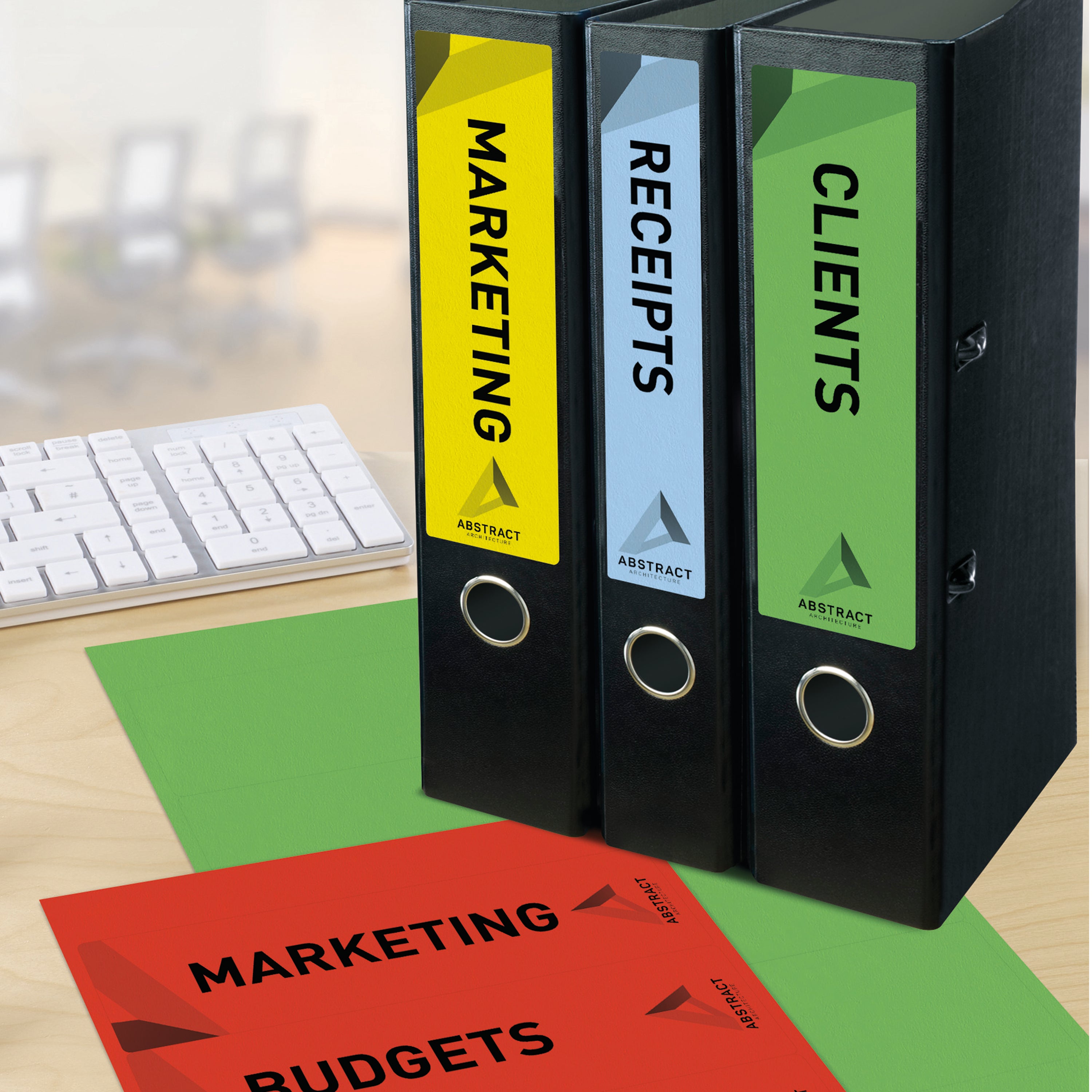 A row of organized binders featuring Avery lever arch spine labels.