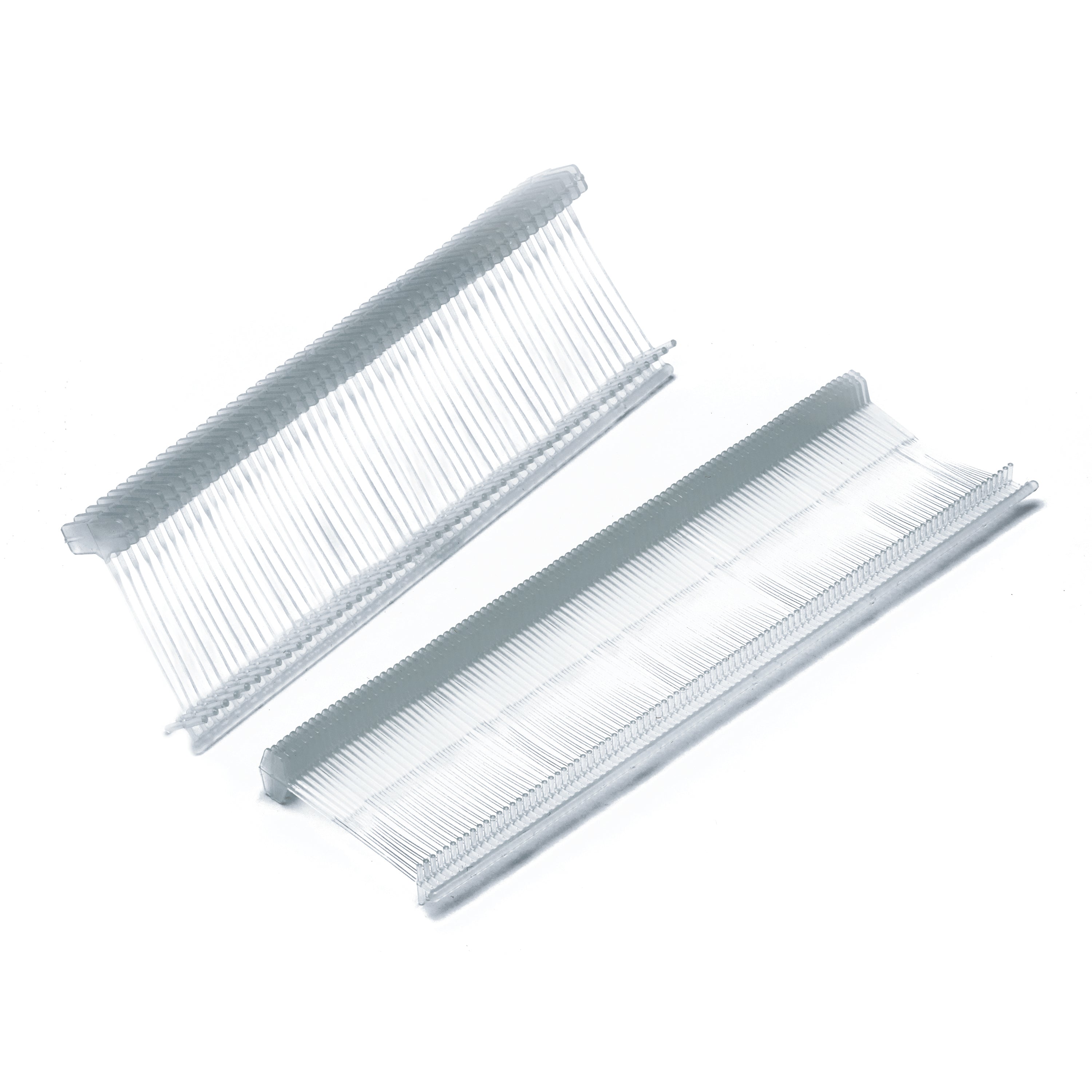 A clip of natural-colored 65mm standard fasteners from recycled plastic.
