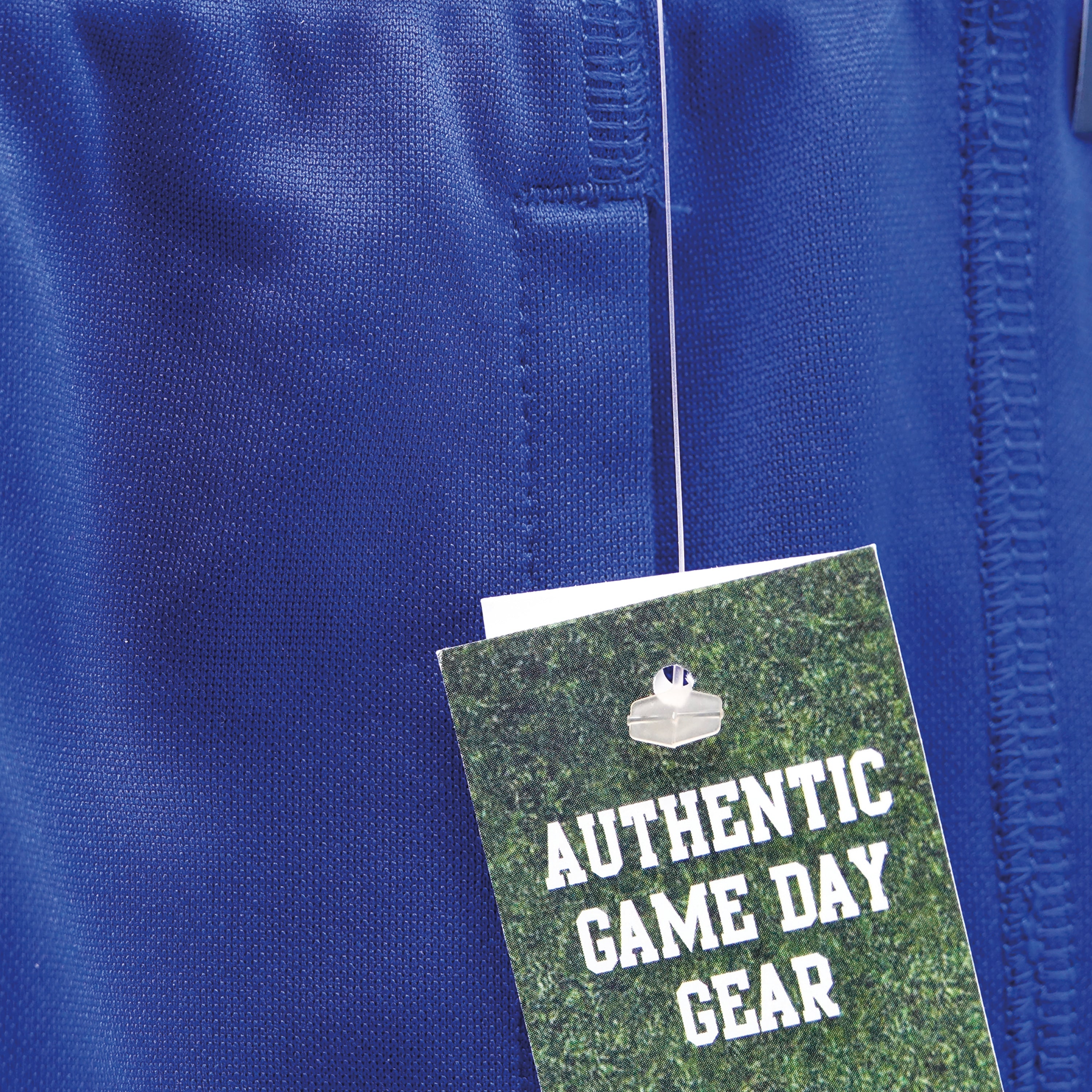 A 65mm standard Ecotach fastener tagging a thick fabric item.