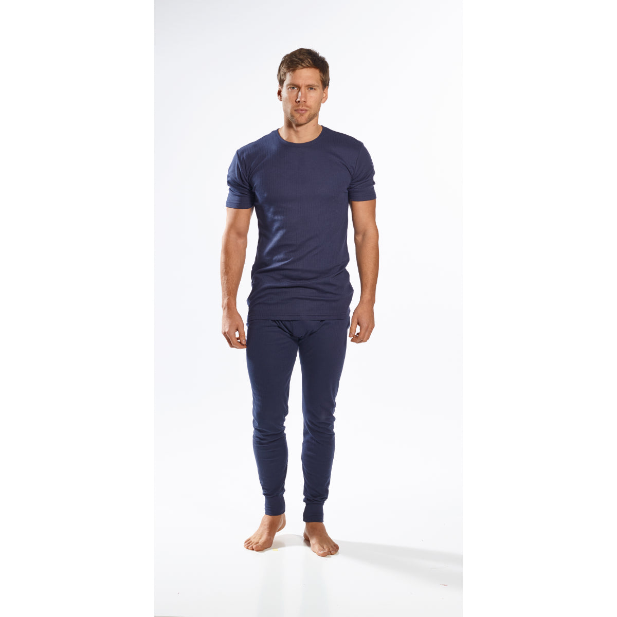 Three-quarter view of men’s navy ribbed thermal short-sleeve top paired with matching leggings
