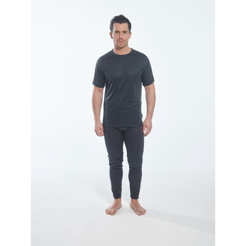 Model wearing the Portwest thermal baselayer top and leggings for warmth.