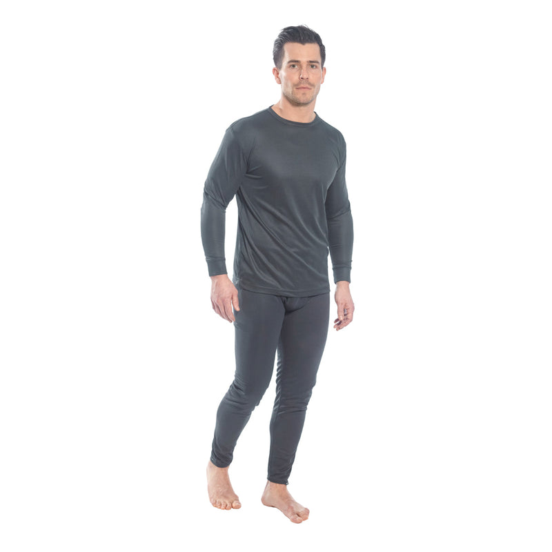 Side view of a model in Portwest thermal baselayer top and leggings.