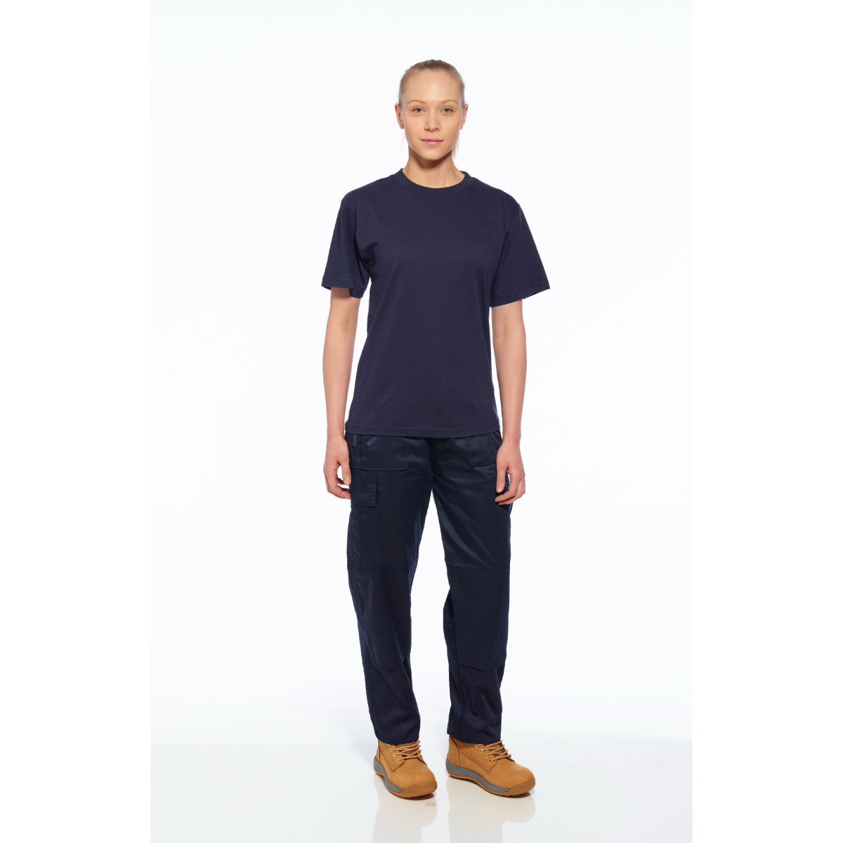 Model wearing Portwest women's action trousers with polo and boots.