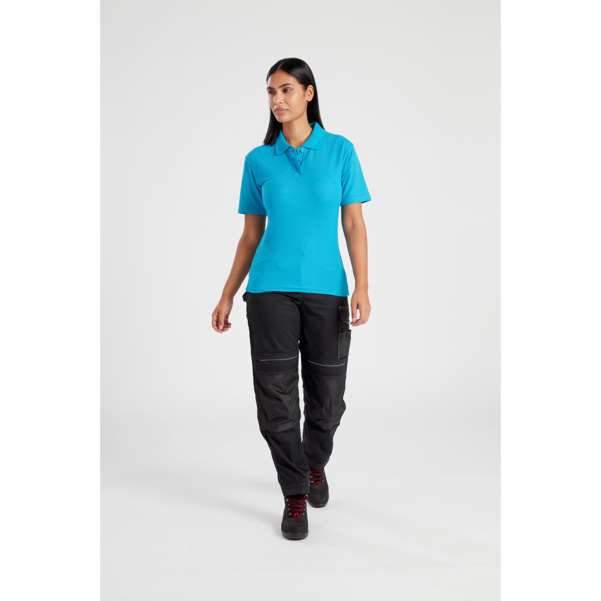 Model looking over her shoulder while wearing the PW3 Women's workwear.