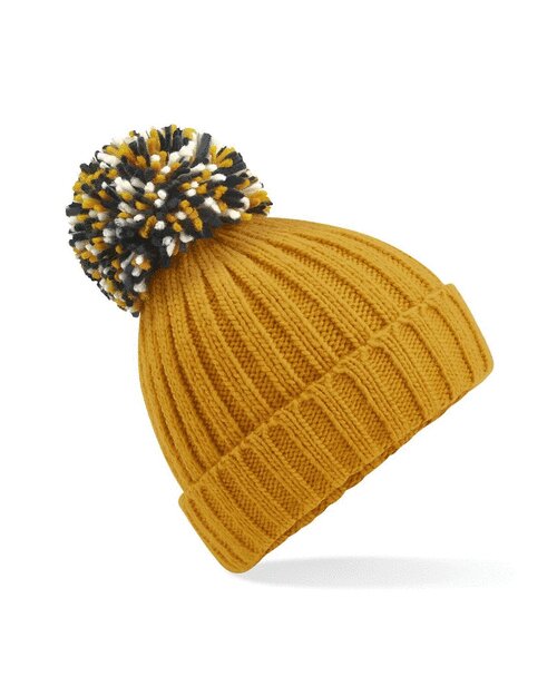 Mustard yellow Beechfield B390 recycled beanie with a fluffy pom pom, laid flat.