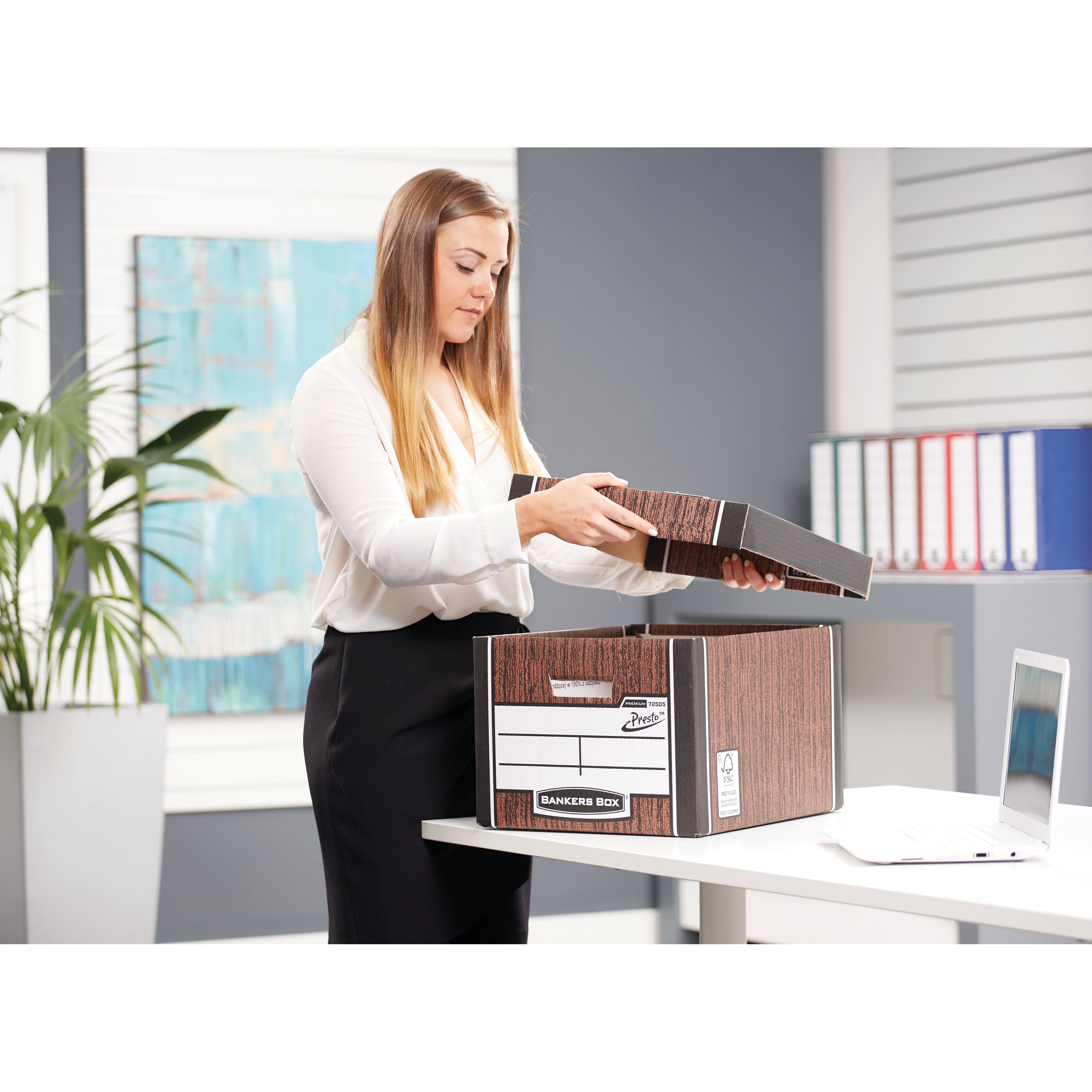 A stylish stack of wood grain Bankers Box Premium Classic boxes for home or office use.