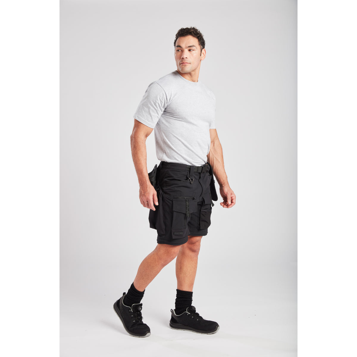 Side view showing large tool pockets on Portwest BX321 trousers