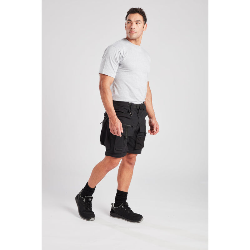 Worker demonstrating the detachable holster pocket of the modular trousers.