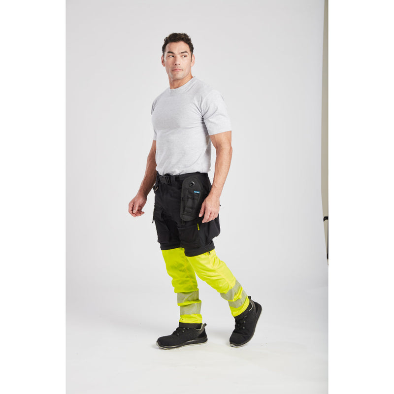 A worker kneeling comfortably in the Ultimate Modular trousers.