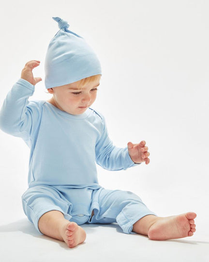 Natural-colored one-knot baby hat by Babybugz, on a baby.
