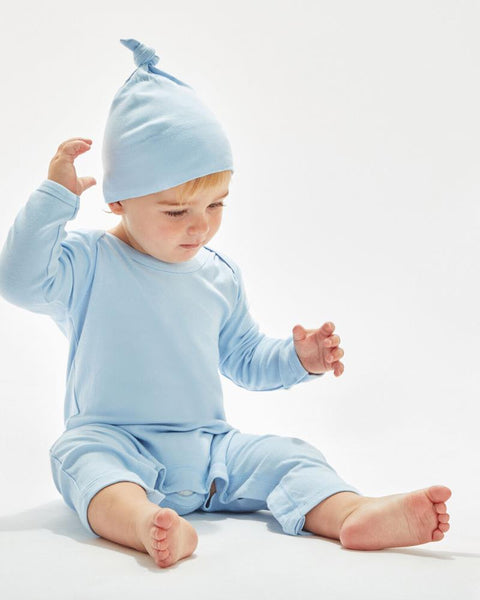 Natural-colored one-knot baby hat by Babybugz, on a baby.