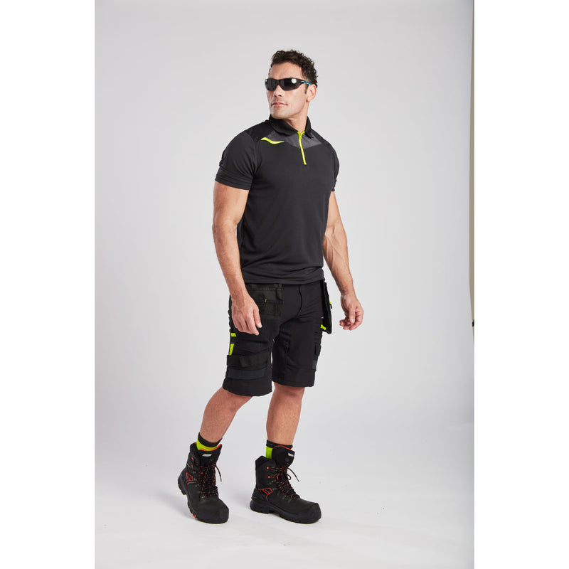 Side view of a model wearing the Portwest DX4 Holster Shorts
