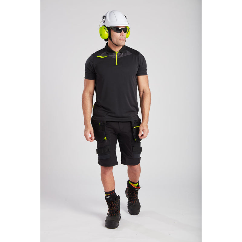 Man on a job site wearing full Portwest PPE including helmet and glasses.