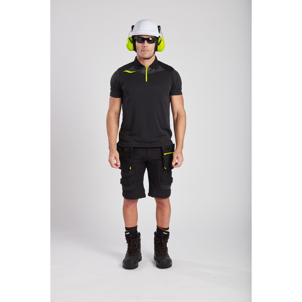 Model in a working pose wearing the Portwest DX4 Holster Shorts