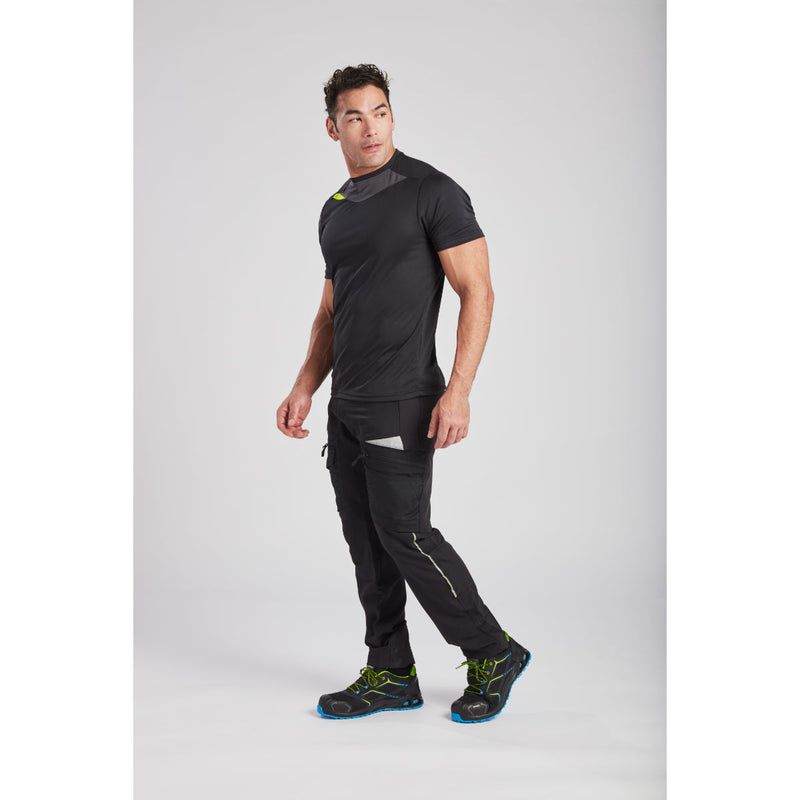 Angled view of a man showing the slim fit of the blue Portwest DX4 T-Shirt.
