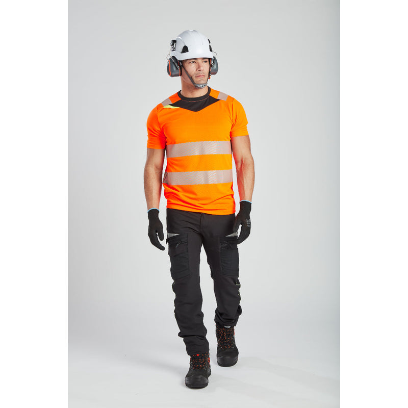 Side profile of a model wearing the yellow Portwest DX4 Hi-Vis T-Shirt and gear.