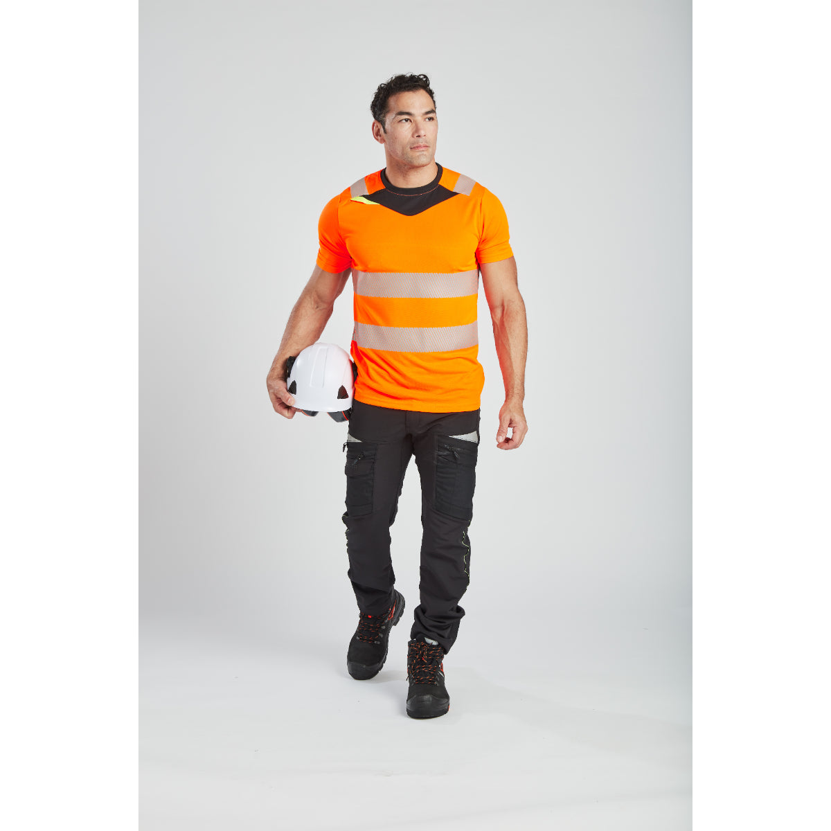 Front view of a model demonstrating the fit of the Portwest safety helmet and ear muffs.