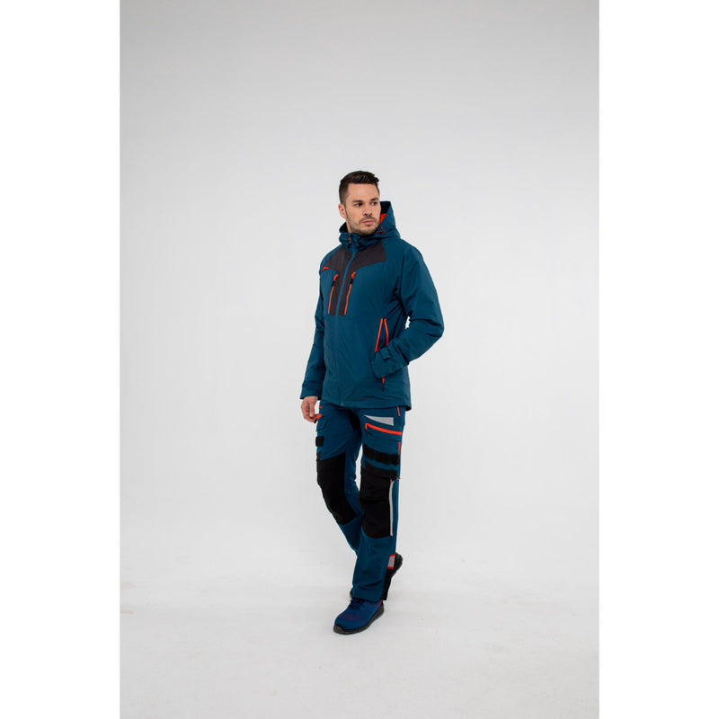 Rear view of a model showing the fit of the black Portwest DX4 jacket and trousers.
