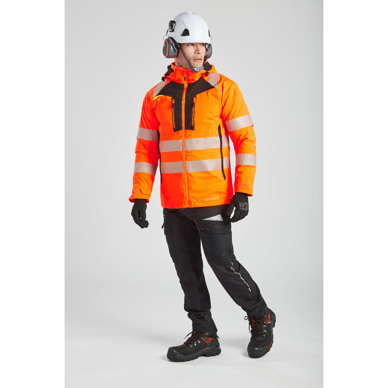 Side view of a model in orange winter gear, showing the fit of the PW62 ear muffs.