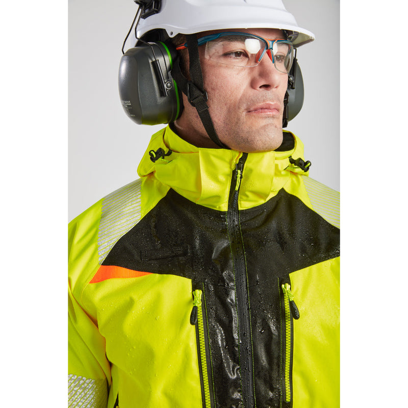 Worker on a construction site wearing Portwest helmet and Mega KN glasses.