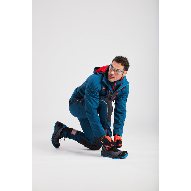 Man in Portwest DX4 Quarter-Zip Hoodie and work pants showing the garment's length.