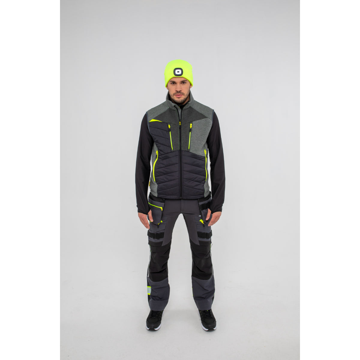 Black Portwest DX4 Zip Base Layer on a hanger showcasing its form-fitting design.