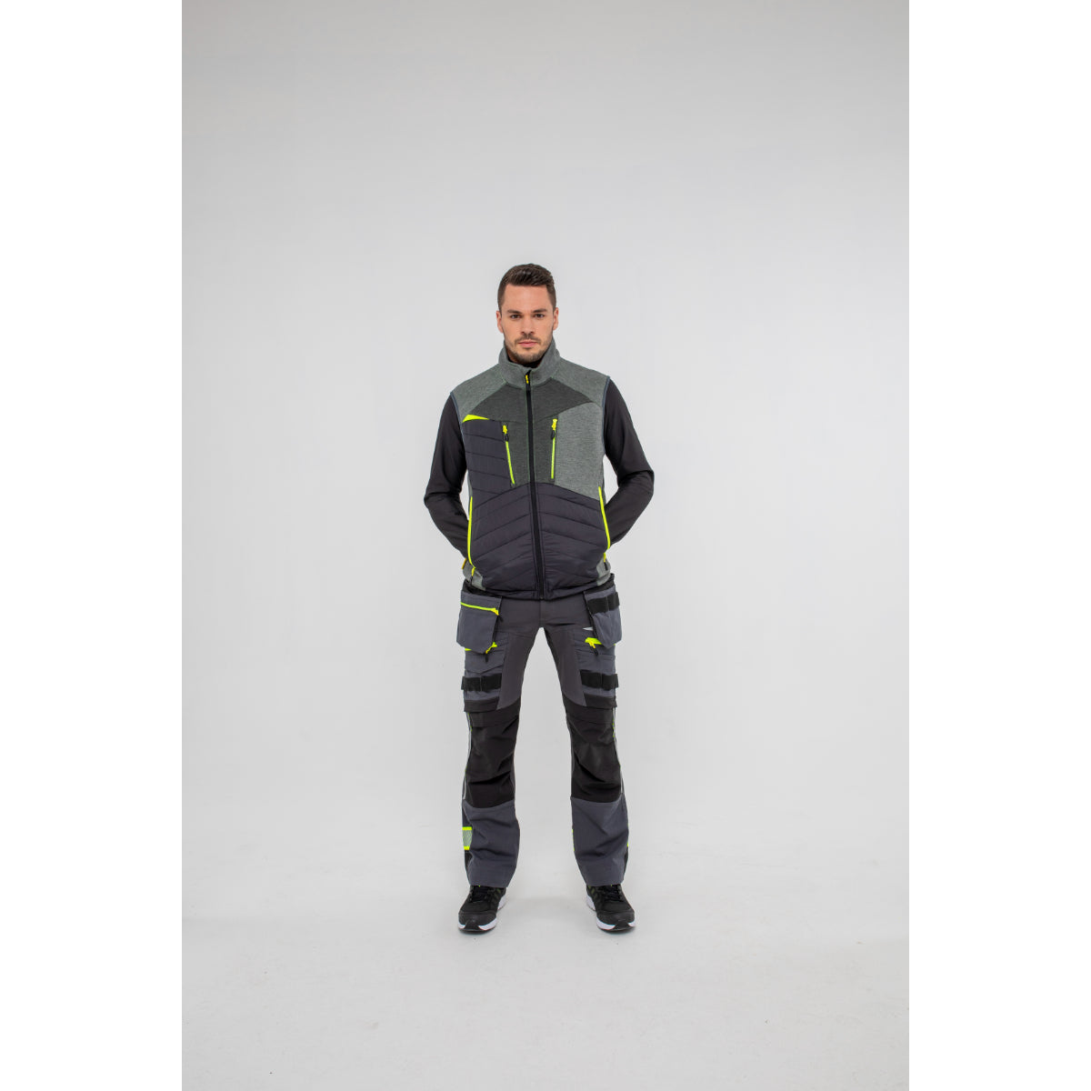 Man in Portwest DX4 Zip Base Layer showing full range of motion.