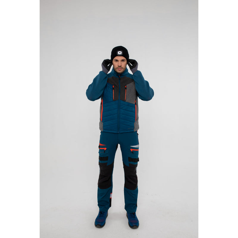 Side view of a man in a Portwest DX4 Hybrid Baffle Jacket highlighting arm and body fit.