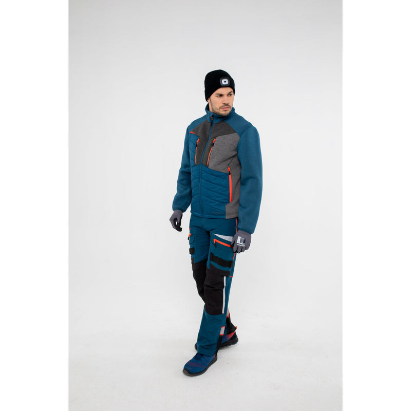 Back view of a man in a Portwest DX4 Hybrid Baffle Jacket showing insulated back panel.